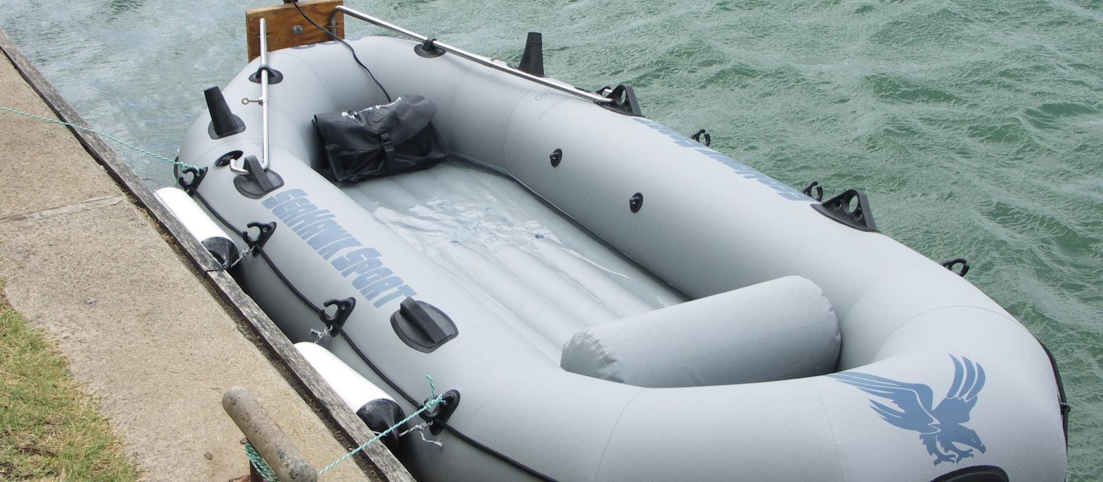 PVC inflatable boat with small electric trolling outboard motor